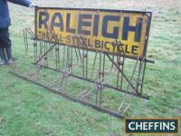 Raleigh, The All-Steel Bicycle, an original period 8-bike rack, complete with original enamel sign, bearing some older sympathetic repairs, 8ft long, 22ins deep and 45ins tall. Ex-Goodwood Revival Tour de France set