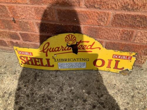 Guaranteed Double Shell Lubricating Oil, an enamel sign depicting the fat bodied pectern shell, losses
