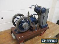 Stuart Turner c1920s 1/4hp horizontal, twin flywheel, open crank petrol stationary engine. Stated to be in good condition and equipped with petrol and cooling tanks, buzz coil and mounted to a hardwood trolley