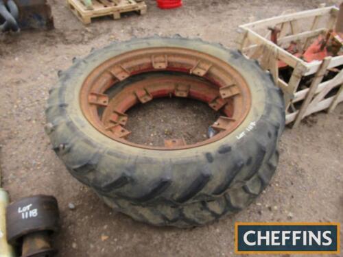 Early pair of Nuffield 9.00-36 wheel rims and closed tread tyres, early TVO rims original