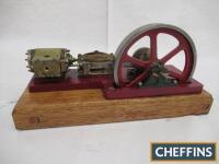 Scratch-built model of single cylinder horizontal mill steam engine with brass-clad cylinder mounted to a wooden base, motion moving freely (flywheel diameter 6ins, base 13.5x5.5ins)