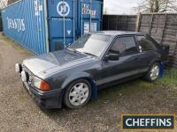 1983 1597cc Ford Escort RS1600i Reg. No. A320 VNP Chassis No. WFOBXXGCABDY43350 Engine No. DY43350 A black example of the famous 1980s boy racer saloon fitted with front spoiler, spot lamps and a full roll cage. HPI clear and offered for sale with curren