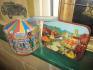 Churchill magical carousel tin painted by Adrian Chesterman, together with carousel fairground bluebird sweet tin