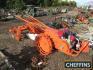 Trusty tractor, finished in orange and complete with drag and plough