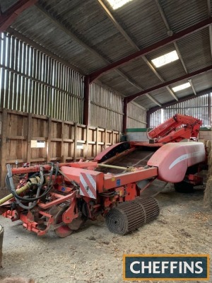 1999 Grimme GZDLS 2row trailed potato harvester with full width digging with half diablos, intake web, followed by web with cascade agitation multi-sep separation system. Unmanned with hydraulic wheel drive, rear low fill water kit, elevator web supplied