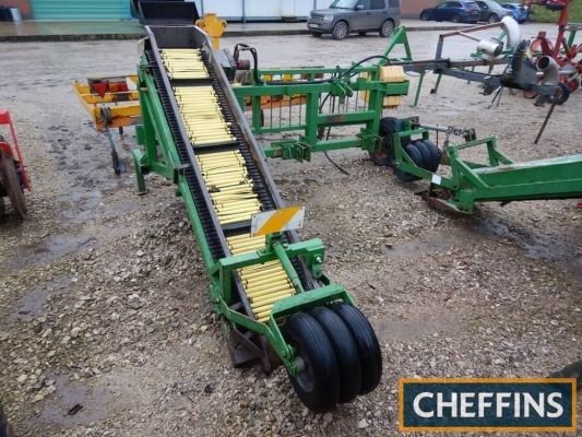 Mounted soil bag filler with 14ins wide loading conveyor with rubber covered steel belted elevator, hydraulic driven sprocket drive to bag chute and manual folding platform