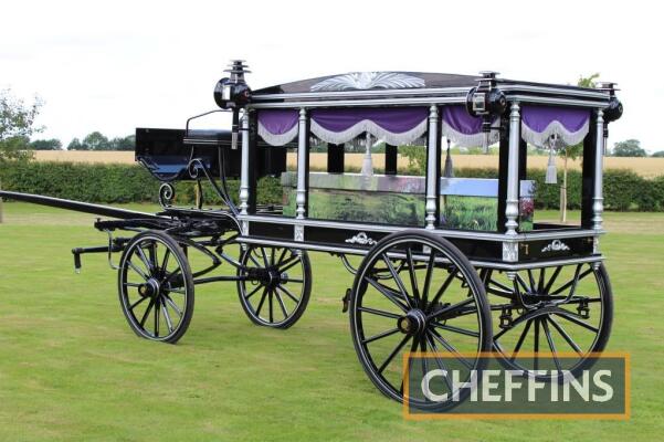 Victorian horse-drawn hearse c1890, built in the UK and restored in 2000 in Poland. An unglazed lightweight `village hearse`, complete with lamps and detachable drapes, suitable to be drawn by a single or pair and supplied with shafts and pole