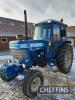 FORD 6710 diesel TRACTOR Fitted with a Q cab and front weights and showing 2,700 hours. Presented in good original condition