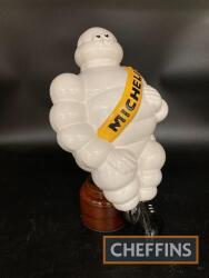 13ins tall Michelin man, teak mounted base, overall height 14ins