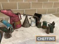 A selection of oil pouring jugs, oiling cans and funnels