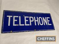 Telephone, a double-sided enamel sign