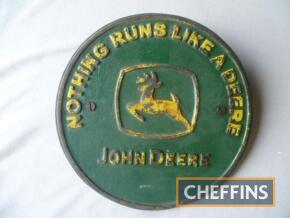 John Deere round cast iron plaque, approximately 20cm in diameter