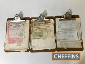 Garage dressing, three clipboards with period invoices, statements etc.