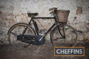 Raleigh bicycle with front and rear lights, basket and Sturmey Archer battery holder