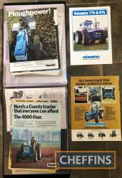 County tractor advertisements and literature in a display book