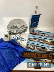 Mercedes-Benz desk flag, bonnet emblem (boxed), Motorsport jacket, illuminating sign and two posters, to include 50 year poster