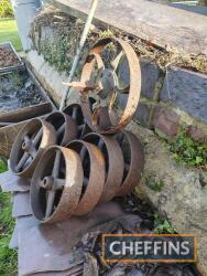 8no. cast iron wheels, together with metal wheelbarrow wheel