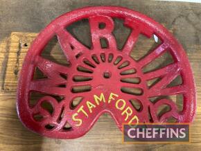 Martin, Stamford, a cast iron seat in red