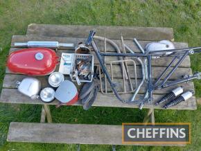 Triumph Tiger Cub frame with swinging arm, petrol tank, oil tank, battery box and various other parts, no frame number, together with workshop manual