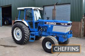 1989 FORD TW-35 II 2wd diesel TRACTOR Fitted with Super Q cab, linkage, drawbar, 222kg inner and 39kg outer rear wheel weights and 12no. 44kg underslung leaf weights on Goodyear 20.8R38 PAVT rear and 16.5L-16.1 front wheels and tyres Reg. No. F159 OTT Ser