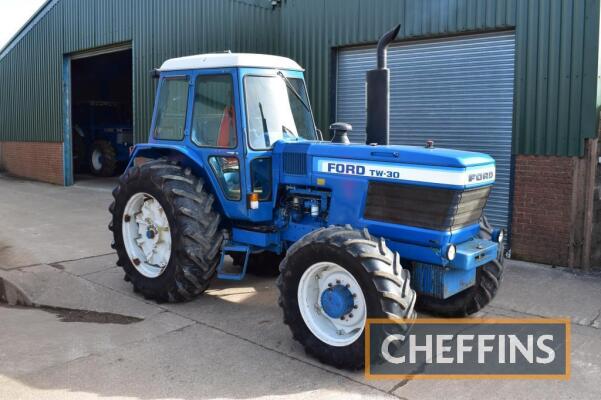 1981 FORD TW-30 4wd diesel TRACTOR Fitted with Q cab, ZF front axle, linkage, dual power, 222kg inner rear wheel weights and 13no. 45kg underslung slab weights on 20.8R38 PAVT rear and 480/65R28 front wheels and tyres Reg. No. FNP 676W Serial No. A909274