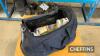 Ernest Doe/Case International holdall duffel bag with contents, to include mugs, Ernest Doe tie and Ernest Doe News from 1995-2015