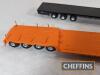 6no. kit-built model flatbed and low-loader lorries including Pickfords Scammell, Mack and Volvo. Believed to be ASAM models. Some damage to details parts such as wing mirrors, spare wheels etc c. 1:48 scale - 8