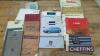 Assorted agricultural books with assorted automotive manuals