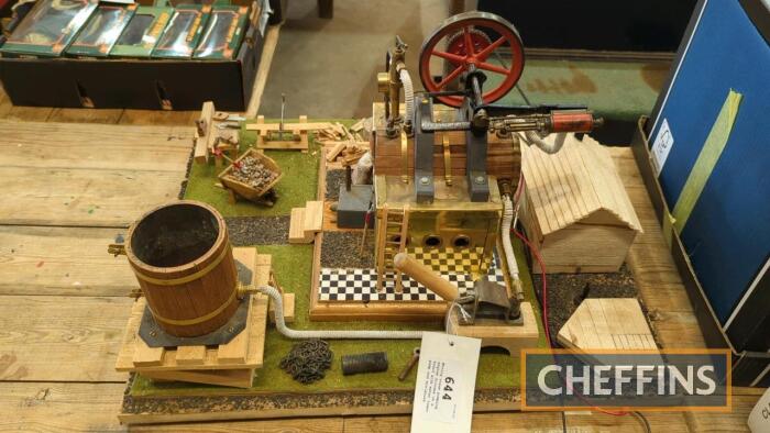 Moving steam pumping engine diorama on a board with water tower, pump and miniature tools. Can be operated by steam or battery c.1970s (23 x 20ins)