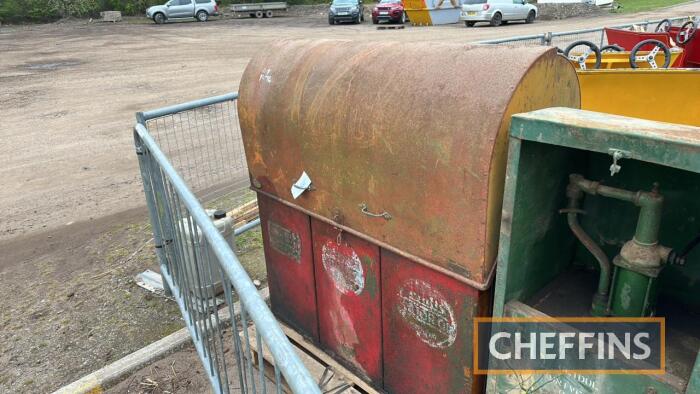 Oil tanks enclosed in roll top cabinet