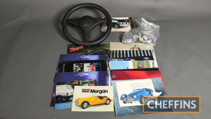 Morgan cars sales brochures together with steering wheel and wheel spinners from the 1998 Plus 8 car featured in the brochure. Also includes build photos