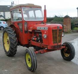 1965 DAVID BROWN 990 Implematic 4cylinder diesel TRACTOR Serial No. 480204 Fitted with a Duncan safety cab in 1971 but retaining the original wings and lights and standing on Goodyear tyres all round. Stated to be one of the last production Implematic mod