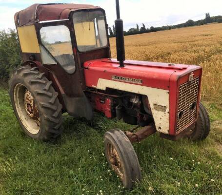 1969 INTERNATIONAL 434 4cylinder diesel TRACTOR Reg. No. XDT 960G Serial No. 21051 Fitted with a cab and rare front weight, rear mounted pulley and pick up hitch. Stated to run and drive well but does jump out of high range gears. V5 available