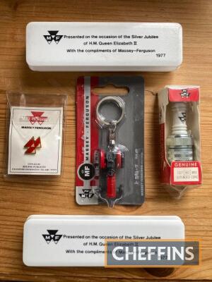 Massey Ferguson a qty of promotional material to inc' enamelled lapel badge, key ring, spark plug and two 1977 Silver Jubilee boxed tea spoons (5)