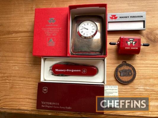 Massey Ferguson a qty of promotional material to inc' Swiss Army knife (boxed), 125 year medal, speed counter, name badge, boxed 50 years at Banner Lane desk clock (5)