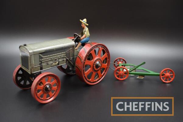 Bing tinplate clockwork tinplate Fordson tractor and 3furrow plough, 17ins long overall