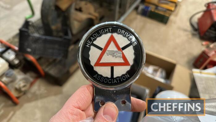 Headlight drivers association grille badge