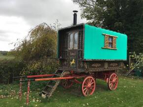 Square top horse drawn Gypsy wagon. Well built on a Leeds style dray stamped 1909, the wheel hubs are marked for R Tyrell 56 Great Queen Street, London. Spacious and well finished inside with the benefit of 2 side windows. Fitted with a Queenie stove with