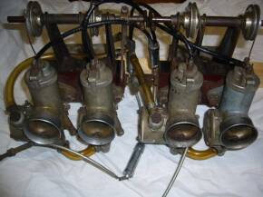 Set of 4 Amal 389 Monoblock carbs on manifolds c/w cables, brackets etc. Believed off racing Ford saloon