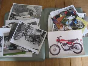 Two folders of motorcycle photos by many hands with much annotation, covers all types of machines from all era's and and includes studio images, a large qty