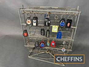 Original point of sale keyring stand c/w motoring keyrings to inc' Esso, BMW, Regent etc