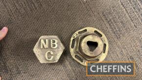 National Benzole Co brass caps that would have been fitted to underground fuel storage tanks
