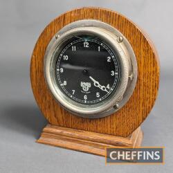 Automotive dashboard clock mounted in hardwood surround as a desk clock thought to be ex-Austin 7. Damage to glass
