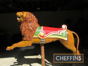 A very rare Anderson Juvenile Lion with iron tail c:1900 I believe this was on a ride Alf Scorrott owned hence the AS carved on the saddle blanket