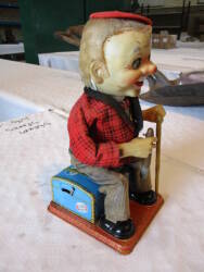 Japanese articulated tin plate toy 'Mr McGregor', battery operated figure who stands and blows smoke from cigar