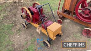 1915 Amanco 'Johnny Boy' 1.5bhp single cylinder horizontal open crank water cooled stationary engine with twin flywheels, hit and miss magneto on wooden trolley Serial No. 254896