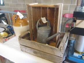 An ash apple box and watering can