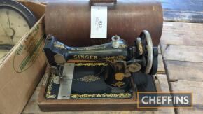 Singer sewing machine complete with wooden storage case