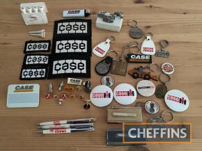 Qty of Case IH collectibles including badges, key rings, cuff links etc