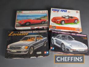 Tamiya Porsche 959 and Mercedes 5000 Lorinser model kits (unbuilt) together with Burago Dodge Viper (unbuilt) and Revell Jaguar XK-E (started) model kits